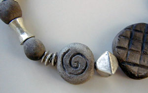 pit fired clay beads and silver necklace by Vicky Jousan